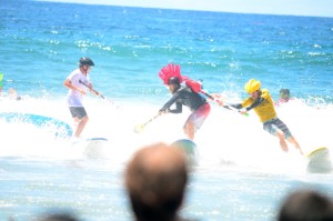 The fierce warriors battle fiercely in the fierce sea during the surf joust competition. Photo by Tony Cagala