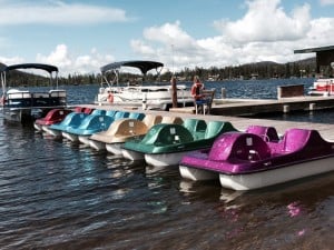 Early mornings, these sparkly watercraft are lined up at the dock at Grand Lake. Hotels, shops, boutiques, restaurants and some historic buildings that tell the history of this town are within walking distance. 
