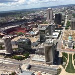 Looking west from the top of the Gateway Arch, visitors can see for miles on a clear day. The Old Courthouse is at the middle right; Busch Stadium, home of the popular St. Louis Cardinals baseball team, is middle left. The steeple of the Old Cathedral can be seen at the bottom of the photo. (E’Louise Ondash)
