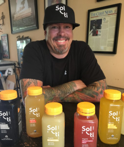 Solti San Diego Regional Sales Manager Christian Sutton with some of their fabulous juice. Photo David Boylan 